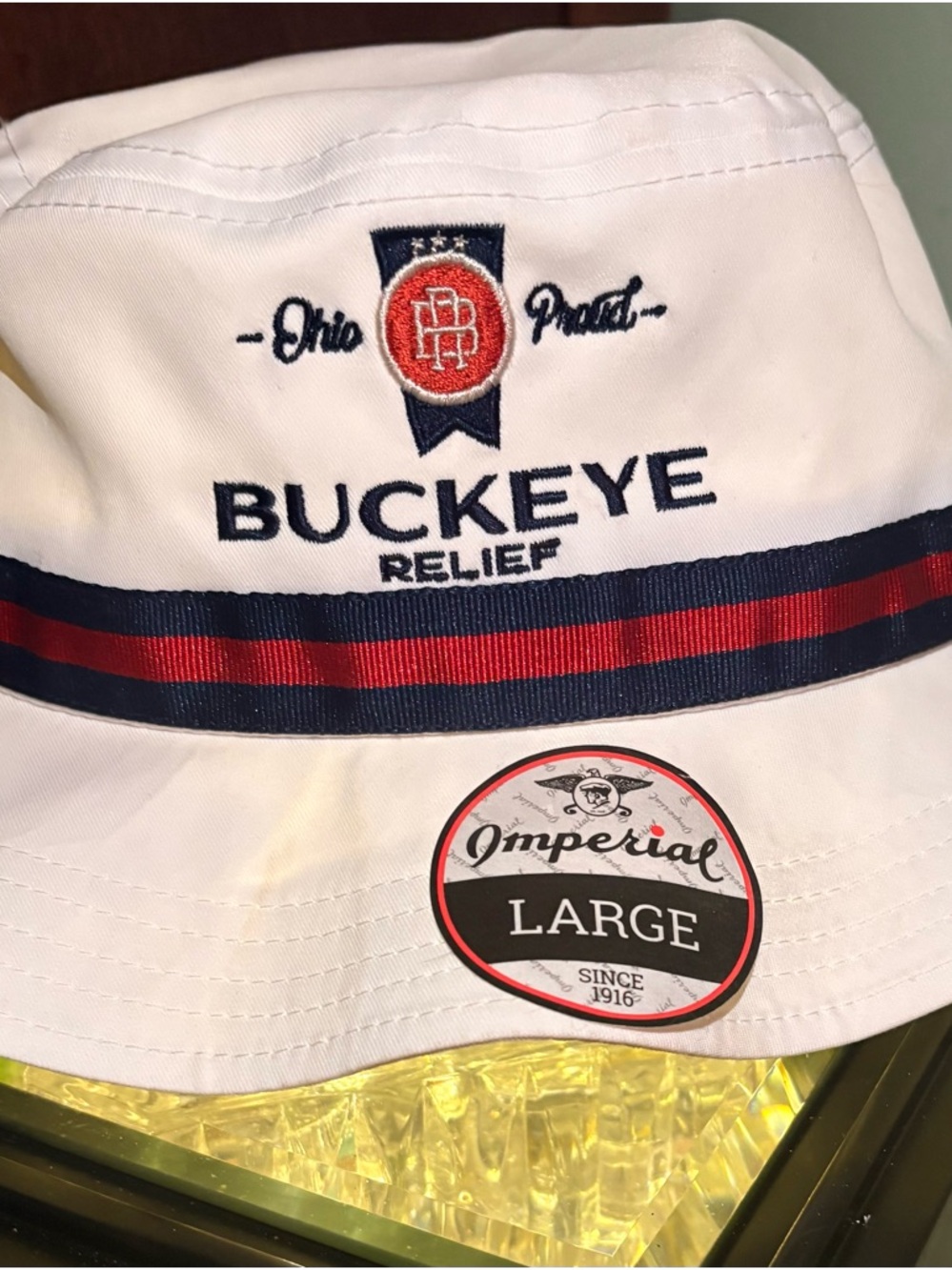 Buckeye Relief White Bucket Hat with Navy & Red Stripe